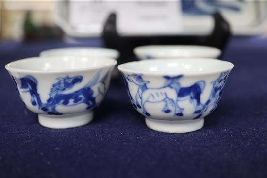 Six 19th century Chinese blue and white horses tea bowls and a later blue and white tray length 16cm